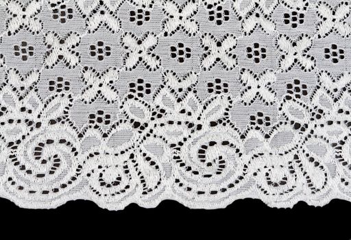 white lace with a floral pattern on a black background