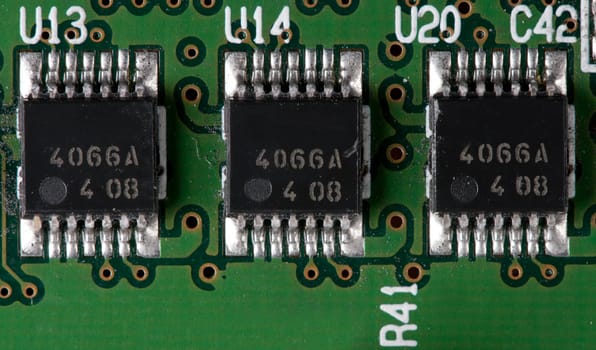 chips on a green printed electronic board