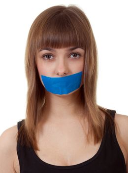 beautiful girl with her mouth sealed with blue tape