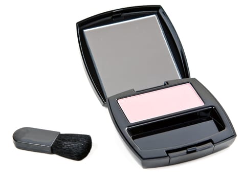 cosmetic set rouge with mirror and brush in a black plastic casing with a white background