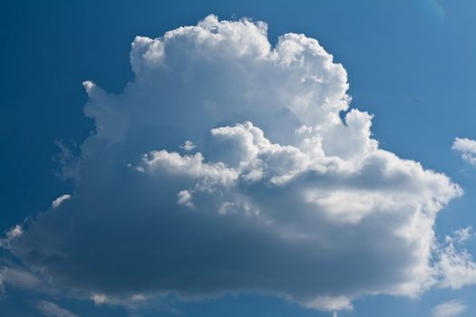 beautiful surround a white cloud against the blue sky saturated