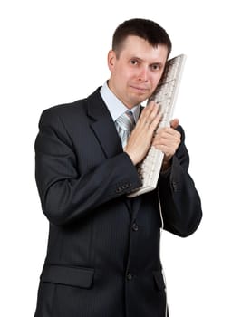 Businessman with a keyboard at the head isolated on a white background