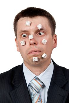 word STUPID vylodennoe buttons on the face of businessman on white background