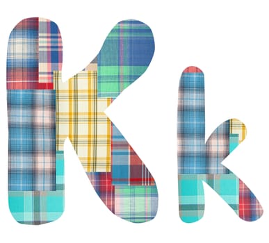 collage letter "K" of the color patches checkered fabric on a white background
