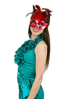 brunette girl in a blue dress and a masquerade mask on a white background