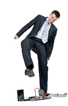 Businessman trampling foot motherboard on a white background