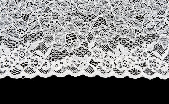 White patterned lace isolated on black background