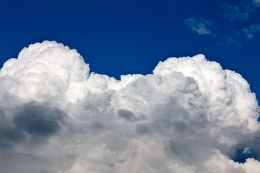 beautiful cumulus clouds against a background of rich blue sky