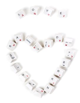 word love and the heart laid out keys from the keyboard on a white background