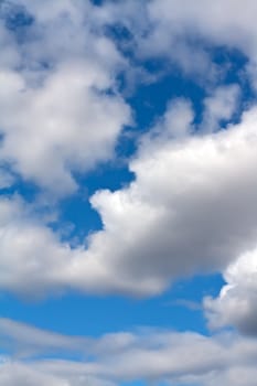 Beautiful cumulus clouds against a blue sky