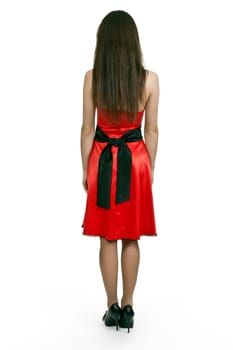 Woman in red dress is back on a white background