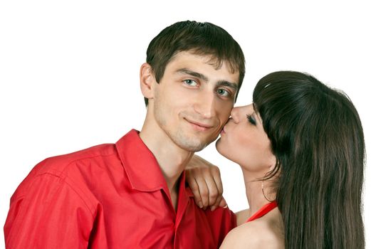 woman kisses a man on the cheek on a white background