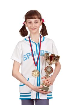 Girl with a medal and a gold cup on a white background