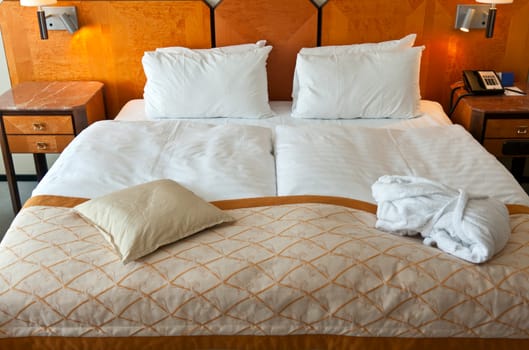 bed in a hotel room with bedside tables