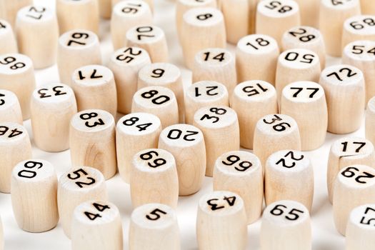 wooden barrels with lotto numbers on a white background