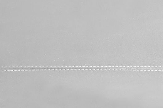 gray  horizontal stitched leather background  
