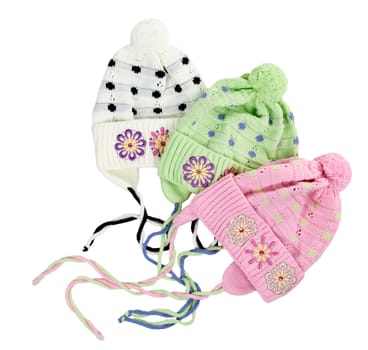 three colored children's knitted hat with a flower pattern on a white background