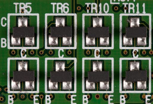 chips on a green printed electronic board