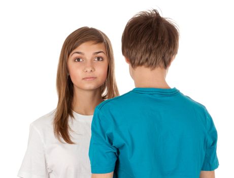 girl looks out from a guy on a white background