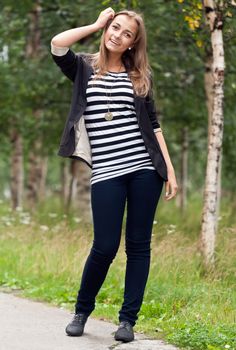 Beautiful girl on a background of birch trees