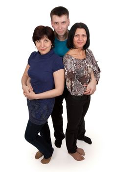 man hugging two middle-aged women on a white background