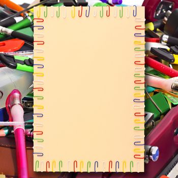 illustration of a sheet of A4 paper in a frame of colored paper clips in the background stationery