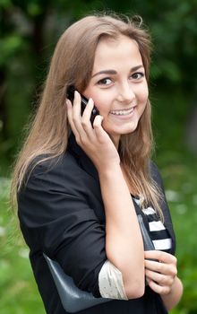 portrait of a girl on the phone a forest