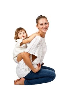 Mother and daughter sitting in the studio on a white background