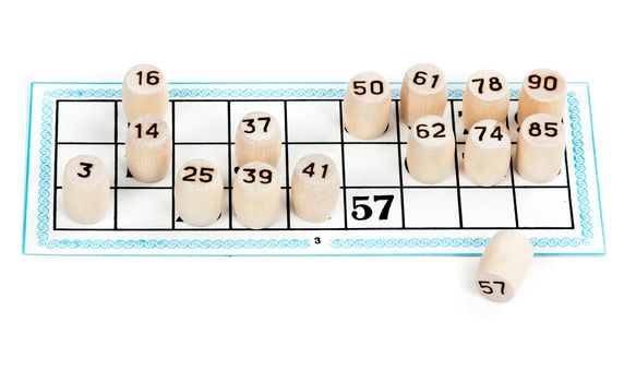 Wooden barrels lotto numbers on the card carton for the game