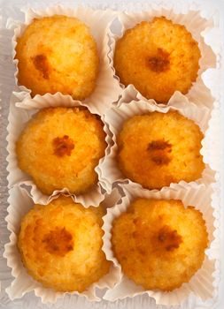 coconut cake in six corrugated wrappers