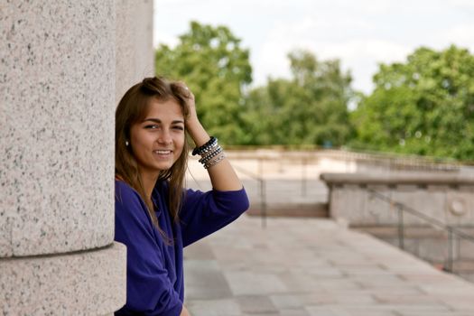 beautiful girl in the column of the Finnish parliament in Helsinki