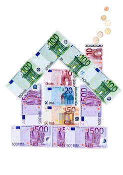 House of euro banknotes with coins in the form of smoke from a pipe lined with a white background