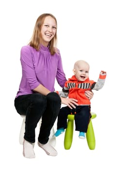 Mother and son in a chair in the studio isolated on white background