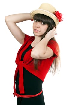 Portrait of brunette girl in a hat with a flower and a red sweater isolated on a white background