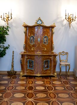 Old vintage dresser, chair and candle holders, interior