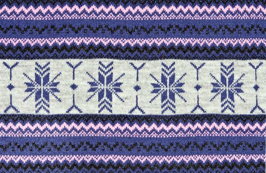 knitted blue background with a pattern.