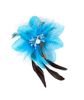 blue flower fabric with feathers and a large pearl in the center