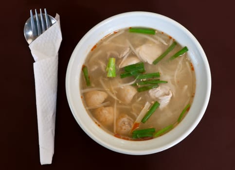 Thai soup dish with meat in brown cloth