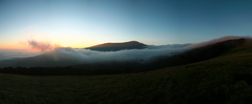 An image of  clouds on the mountains