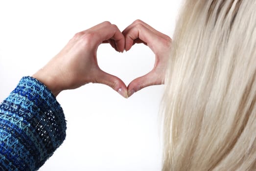 Woman making heart shape with her hands