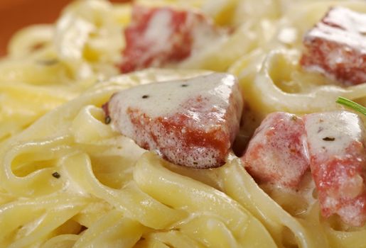 pasta Fettuccine Alfredo with sausage. close-up