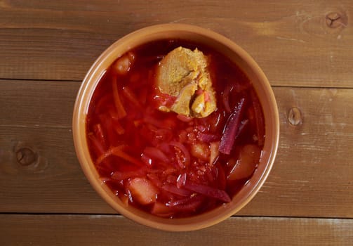 ukrainian and russian red-beet soup (borscht) with garlic and sour cream