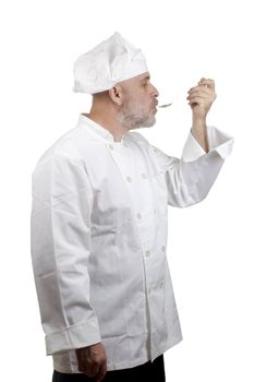 Portrait of a caucasian chef in his uniform on a white background.