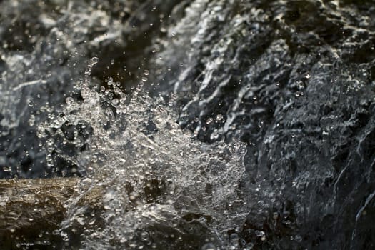 Close view of fast flowing fresh water on a river.