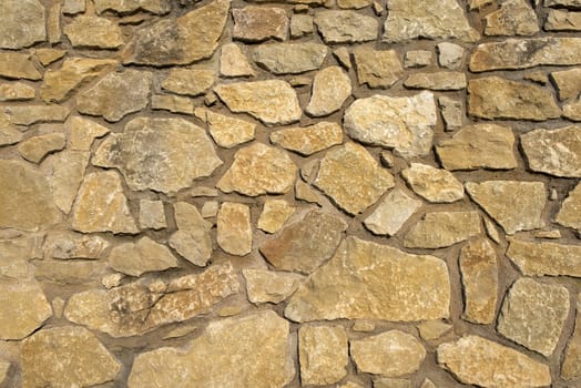 An old brown stone wall makes an excellent background