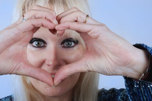 Woman making heart shape with her hands