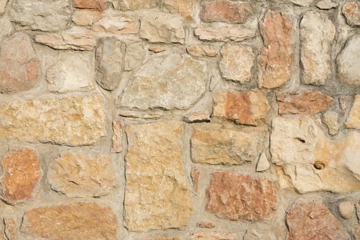 An old brown stone wall makes an excellent background