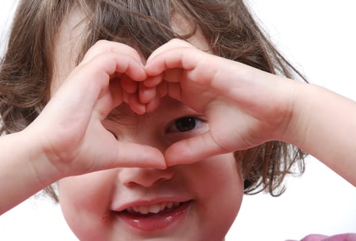 Girl making heart shape with her hands