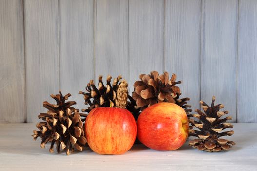 Red apples and pine cones as interior design.