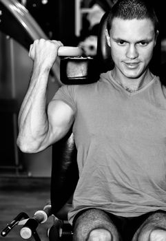 Man doing athlete exercise in fitness club